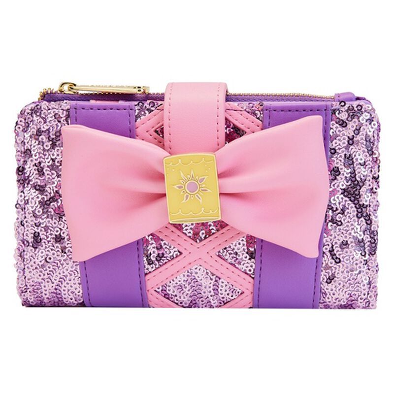 Purple sequin flap wallet in the style of Rapunzel's dress with a pink bow that has a glow-in-the-dark lantern charm in the center